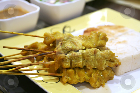To use this stock image in your creative project, please select the size you need over to the right and click the "Add to Cart" button.
Your downloaded image will come with the Cutcaster watermark removed so don’t worry about the watermark you see on this page. Satay skewers stock photo, Satay meat skewers on wooden sticks traditional malaysian cuisine by Kheng Guan Toh