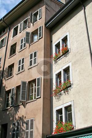 To use this stock image in your creative project, please select the size you need over to the right and click the "Add to Cart" button.
Your downloaded image will come with the Cutcaster watermark removed so don’t worry about the watermark you see on this page. Swiss apartment stock photo, Traditional apartment house with flowers in windows in Geneva Switzerland by Kheng Guan Toh