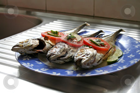 To use this stock image in your creative project, please select the size you need over to the right and click the "Add to Cart" button.
Your downloaded image will come with the Cutcaster watermark removed so don’t worry about the watermark you see on this page. Grilled fish stock photo, Grilled whole fish asian cuisine spicy with garnishing by Kheng Guan Toh