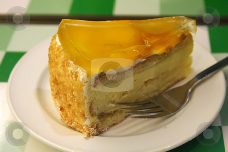 To use this stock image in your creative project, please select the size you need over to the right and click the "Add to Cart" button.
Your downloaded image will come with the Cutcaster watermark removed so don’t worry about the watermark you see on this page. Mango cake stock photo, Mango cream cake on white plate restaurant setting by Kheng Guan Toh