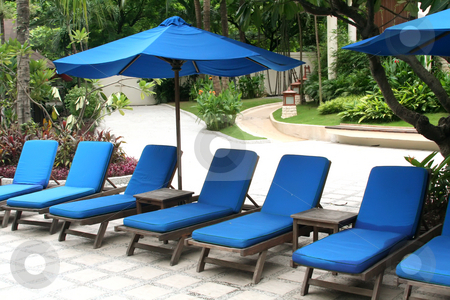 To use this stock image in your creative project, please select the size you need over to the right and click the "Add to Cart" button.
Your downloaded image will come with the Cutcaster watermark removed so don’t worry about the watermark you see on this page. Asia asian chair chairs deck holiday hotel lounge pool poolside stock photo, Poolside deck chairs with umbrellas tropical by Kheng Guan Toh