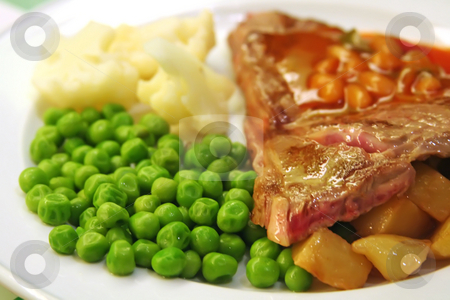 To use this stock image in your creative project, please select the size you need over to the right and click the "Add to Cart" button.
Your downloaded image will come with the Cutcaster watermark removed so don’t worry about the watermark you see on this page. Pork chops stock photo, Pork chops with peas and potatoes restaurant setting by Kheng Guan Toh