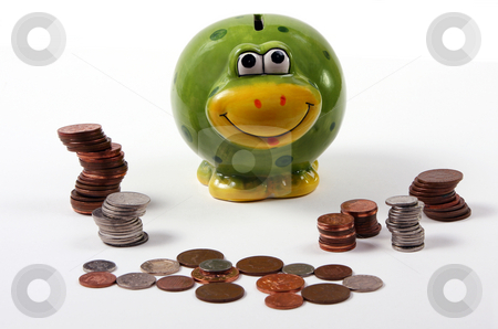 To use this stock image in your creative project, please select the size you need over to the right and click the "Add to Cart" button.
Your downloaded image will come with the Cutcaster watermark removed so don’t worry about the watermark you see on this page. Frog style piggy bank with coins / cash arranged stock photo, Frog style piggy bank with coins / cash / money arranged around it by Mark Allchin