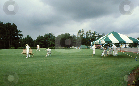 To use this stock image in your creative project, please select the size you need over to the right and click the "Add to Cart" button.
Your downloaded image will come with the Cutcaster watermark removed so don’t worry about the watermark you see on this page. Croquet match stock photo, Setting up field for the game of croquet by Joseph Ligori