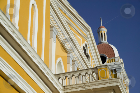 To use this stock image in your creative project, please select the size you need over to the right and click the "Add to Cart" button.
Your downloaded image will come with the Cutcaster watermark removed so don’t worry about the watermark you see on this page. Detail of the Cathedral de Granada Nicaragua stock photo, Architectural detail from the yellow cathedral in central Granada Nicaragua by Scott Griessel