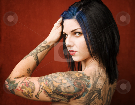 To use this stock image in your creative project, please select the size you need over to the right and click the "Add to Cart" button.
Your downloaded image will come with the Cutcaster watermark removed so don’t worry about the watermark you see on this page. Woman with tattoos stock photo, Pretty young woman with many tattoos on her back and arms by Scott Griessel