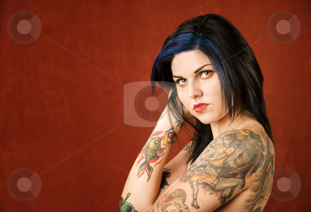 To use this stock image in your creative project, please select the size you need over to the right and click the "Add to Cart" button.
Your downloaded image will come with the Cutcaster watermark removed so don’t worry about the watermark you see on this page. Woman with tattoos stock photo, Pretty young woman with many colorful tattoos by Scott Griessel