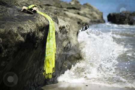 To use this stock image in your creative project, please select the size you need over to the right and click the "Add to Cart" button.
Your downloaded image will come with the Cutcaster watermark removed so don’t worry about the watermark you see on this page. Sandals by the shore stock photo, Sandals on a rock with ocean wave in the background by Scott Griessel