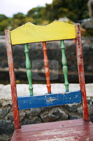 To use this stock image in your creative project, please select the size you need over to the right and click the "Add to Cart" button.
Your downloaded image will come with the Cutcaster watermark removed so don’t worry about the watermark you see on this page. Back of a colorful chair stock photo, Back of a colorful chair with peeling paint in Nicaragua by Scott Griessel