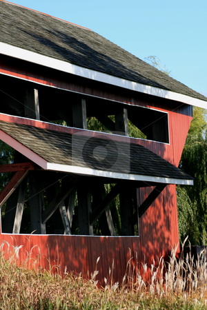 To use this stock image in your creative project, please select the size you need over to the right and click the "Add to Cart" button.
Your downloaded image will come with the Cutcaster watermark removed so don’t worry about the watermark you see on this page. Close up covered bridge stock photo, Close up side view of a 1800's covered bridge. by Betty Hansen