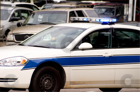 To use this stock image in your creative project, please select the size you need over to the right and click the "Add to Cart" button.
Your downloaded image will come with the Cutcaster watermark removed so don’t worry about the watermark you see on this page. Police Car stock photo, A police car out protecting and serving the public. by Robert Byron