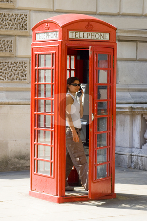 To use this stock image in your creative project, please select the size you need over to the right and click the "Add to Cart" button.
Your downloaded image will come with the Cutcaster watermark removed so don’t worry about the watermark you see on this page. London's Telephone Box stock photo, Girl inside a traditional English red telephone box by Lee Torrens