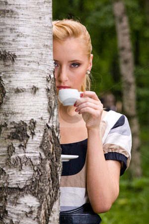 To use this stock image in your creative project, please select the size you need over to the right and click the "Add to Cart" button.
Your downloaded image will come with the Cutcaster watermark removed so don’t worry about the watermark you see on this page. Beautiful young woman and coffee stock photo, Blond lovely young woman drinking cup coffee outside by Vitaly Sokolovskiy