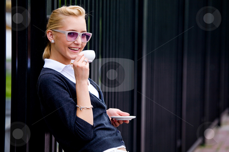 To use this stock image in your creative project, please select the size you need over to the right and click the "Add to Cart" button.
Your downloaded image will come with the Cutcaster watermark removed so don’t worry about the watermark you see on this page. Beautiful young woman and coffee stock photo, Smiling lovely young woman drinking coffee outside by Vitaly Sokolovskiy