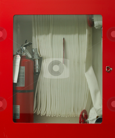 To use this stock image in your creative project, please select the size you need over to the right and click the "Add to Cart" button.
Your downloaded image will come with the Cutcaster watermark removed so don’t worry about the watermark you see on this page. Fire Hose stock photo, Fire Hose and extinguisher in Glass Cabinet by Will Burwell