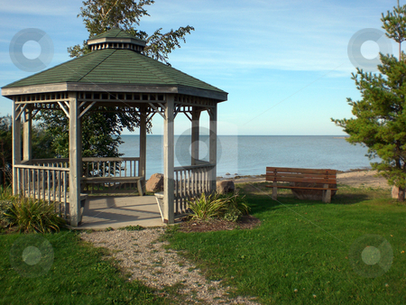To use this stock image in your creative project, please select the size you need over to the right and click the "Add to Cart" button.
Your downloaded image will come with the Cutcaster watermark removed so don’t worry about the watermark you see on this page. Beach gazebo stock photo, by J.G. Byers