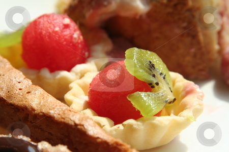To use this stock image in your creative project, please select the size you need over to the right and click the "Add to Cart" button.
Your downloaded image will come with the Cutcaster watermark removed so don’t worry about the watermark you see on this page. Dessert pastries stock photo, Dessert fruit cups and pastries on white plate by Kheng Guan Toh