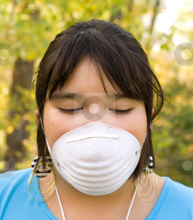 To use this stock image in your creative project, please select the size you need over to the right and click the "Add to Cart" button.
Your downloaded image will come with the Cutcaster watermark removed so don’t worry about the watermark you see on this page. Dust Mask stock photo, A nine year old girl wearing a dust mask outside by Richard Nelson