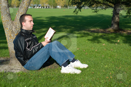 To use this stock image in your creative project, please select the size you need over to the right and click the "Add to Cart" button.
Your downloaded image will come with the Cutcaster watermark removed so don’t worry about the watermark you see on this page. Man Reading Outside stock photo, A young man reading a novel outside by Richard Nelson
