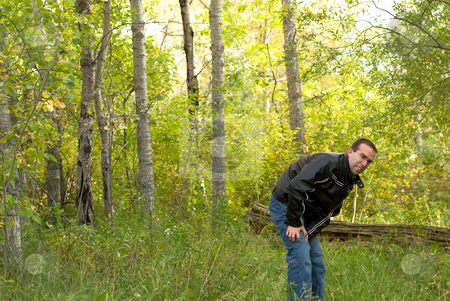 To use this stock image in your creative project, please select the size you need over to the right and click the "Add to Cart" button.
Your downloaded image will come with the Cutcaster watermark removed so don’t worry about the watermark you see on this page. Man With Poison Ivy stock photo, A man coming out of the bush scratching himself because he is itchy by Richard Nelson