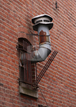 To use this stock image in your creative project, please select the size you need over to the right and click the "Add to Cart" button.
Your downloaded image will come with the Cutcaster watermark removed so don’t worry about the watermark you see on this page. Furnace Vent Pipes stock photo, Old furnace vent pipes protruding out of a window and the security bars, by Betty Hansen