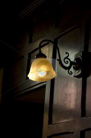 To use this stock image in your creative project, please select the size you need over to the right and click the "Add to Cart" button.
Your downloaded image will come with the Cutcaster watermark removed so don’t worry about the watermark you see on this page. Old Lamp Shade stock photo, An old fashioned, wall-mounted, lamp shade by Lee Torrens