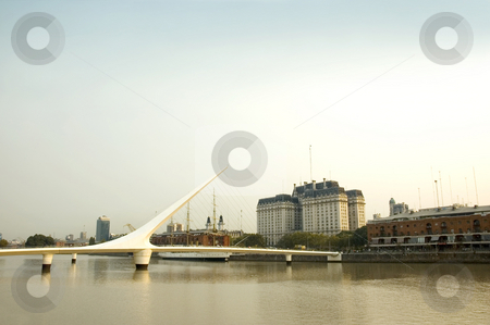 To use this stock image in your creative project, please select the size you need over to the right and click the "Add to Cart" button.
Your downloaded image will come with the Cutcaster watermark removed so don’t worry about the watermark you see on this page. Puente de la mujer, Buenos Aires stock photo, Puente de la mujer - Women's Bridge crossing Puerto Madero in Buenos Aires, the capital of Argentina. by Lee Torrens