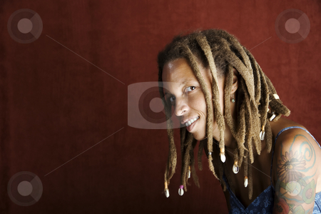 To use this stock image in your creative project, please select the size you need over to the right and click the "Add to Cart" button.
Your downloaded image will come with the Cutcaster watermark removed so don’t worry about the watermark you see on this page. African American Woman stock photo, Pretty African American Woman with Hair in Dreadlocks by Scott Griessel