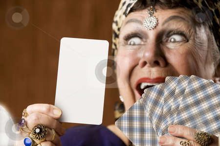 To use this stock image in your creative project, please select the size you need over to the right and click the "Add to Cart" button.
Your downloaded image will come with the Cutcaster watermark removed so don’t worry about the watermark you see on this page. Fortune Teller with Blank Tarot Card stock photo, Gypsy fortune teller hiolding a blank tarot card by Scott Griessel
