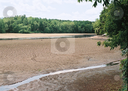 To use this stock image in your creative project, please select the size you need over to the right and click the "Add to Cart" button.
Your downloaded image will come with the Cutcaster watermark removed so don’t worry about the watermark you see on this page. Dry river bed in Wisconsin stock photo, Cracked clay and soft mud imply the affects of dry weather on the Rock River bed in Wisconsin. by Bruce Peterson