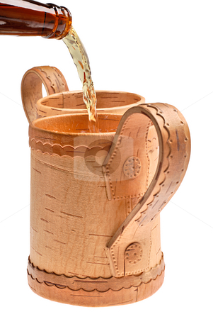To use this stock image in your creative project, please select the size you need over to the right and click the "Add to Cart" button.
Your downloaded image will come with the Cutcaster watermark removed so don’t worry about the watermark you see on this page. Beer flows into stock photo, Wooden mugs for beer on white background by Vadim Maier