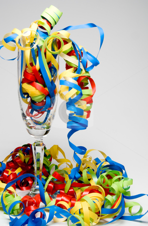To use this stock image in your creative project, please select the size you need over to the right and click the "Add to Cart" button.
Your downloaded image will come with the Cutcaster watermark removed so don’t worry about the watermark you see on this page. Wine Flute and Streamers stock photo, Party time with wine flute and streamers. by Robert Byron