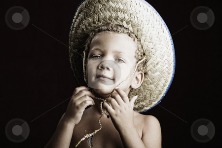 To use this stock image in your creative project, please select the size you need over to the right and click the "Add to Cart" button.
Your downloaded image will come with the Cutcaster watermark removed so don’t worry about the watermark you see on this page. Little Boy in a Straw Hat stock photo, Little boy with curly hair and blue eyes in a straw hat by Scott Griessel