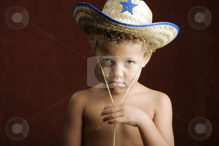 To use this stock image in your creative project, please select the size you need over to the right and click the "Add to Cart" button.
Your downloaded image will come with the Cutcaster watermark removed so don’t worry about the watermark you see on this page. Little Boy in a Sheriff Hat stock photo, Little boy with curly hair and blue eyes in a sheriff hat by Scott Griessel