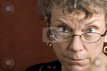 To use this stock image in your creative project, please select the size you need over to the right and click the "Add to Cart" button.
Your downloaded image will come with the Cutcaster watermark removed so don’t worry about the watermark you see on this page. Woman looking over her glasses stock photo, Senior woman looking over the top of her glasses by Scott Griessel