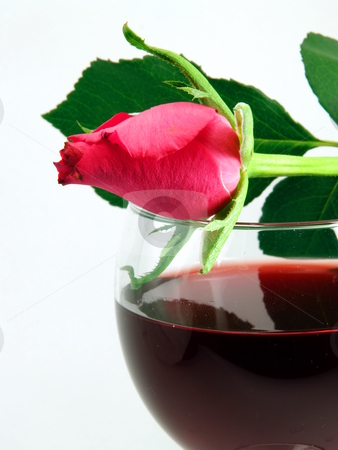 To use this stock image in your creative project, please select the size you need over to the right and click the "Add to Cart" button.
Your downloaded image will come with the Cutcaster watermark removed so don’t worry about the watermark you see on this page. Wine glass stock photo, Wine glass with a rose beside and red wine, on a table, with white bagground by Steen Bartholin Nielsen