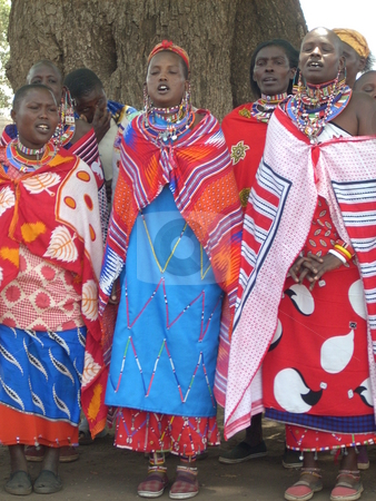 To use this stock image in your creative project, please select the size you need over to the right and click the "Add to Cart" button.
Your downloaded image will come with the Cutcaster watermark removed so don’t worry about the watermark you see on this page. Masai Women singing stock photo, by Rose Nthiwa