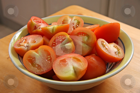 To use this stock image in your creative project, please select the size you need over to the right and click the "Add to Cart" button.
Your downloaded image will come with the Cutcaster watermark removed so don’t worry about the watermark you see on this page. Sliced tomatoes stock photo, Fresh cut sliced raw red tomatoes arranged in bowl by Kheng Guan Toh