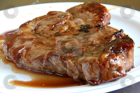 To use this stock image in your creative project, please select the size you need over to the right and click the "Add to Cart" button.
Your downloaded image will come with the Cutcaster watermark removed so don’t worry about the watermark you see on this page. Pork chop stock photo, Cooked pork chop on a white plate oozing juices by Kheng Guan Toh