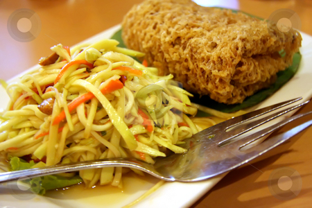 To use this stock image in your creative project, please select the size you need over to the right and click the "Add to Cart" button.
Your downloaded image will come with the Cutcaster watermark removed so don’t worry about the watermark you see on this page. Thai salad stock photo, Thai vegetable and crispy fish salad traditional cuisine by Kheng Guan Toh