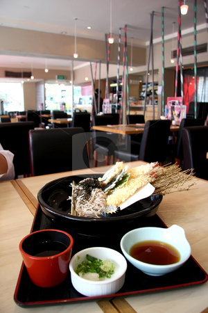 To use this stock image in your creative project, please select the size you need over to the right and click the "Add to Cart" button.
Your downloaded image will come with the Cutcaster watermark removed so don’t worry about the watermark you see on this page. Udon and tempura stock photo, Japanese cuisine udon and tempura fried prawns combo by Kheng Guan Toh