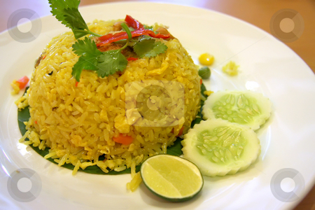 To use this stock image in your creative project, please select the size you need over to the right and click the "Add to Cart" button.
Your downloaded image will come with the Cutcaster watermark removed so don’t worry about the watermark you see on this page. Thai fried rice stock photo, Thai fried rice on plate traditional asian cuisine by Kheng Guan Toh