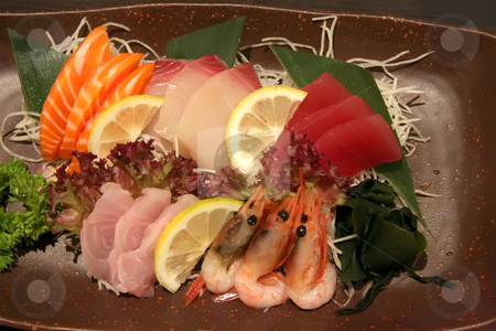 To use this stock image in your creative project, please select the size you need over to the right and click the "Add to Cart" button.
Your downloaded image will come with the Cutcaster watermark removed so don’t worry about the watermark you see on this page. Plate of sashimi stock photo, Arrangement of sashimi sliced raw japanese fish dish by Kheng Guan Toh