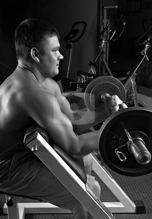 To use this stock image in your creative project, please select the size you need over to the right and click the "Add to Cart" button.
Your downloaded image will come with the Cutcaster watermark removed so don’t worry about the watermark you see on this page. Lifting weights stock photo, Biceps exercise scott bench curl by Vadim Maier