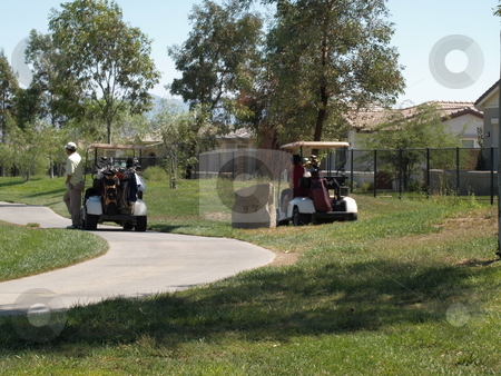 To use this stock image in your creative project, please select the size you need over to the right and click the "Add to Cart" button.
Your downloaded image will come with the Cutcaster watermark removed so don’t worry about the watermark you see on this page. Aproaching the 9th hole stock photo, Golfers approaching the 9th hole in golf carts by Joseph Ligori