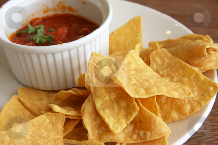 To use this stock image in your creative project, please select the size you need over to the right and click the "Add to Cart" button.
Your downloaded image will come with the Cutcaster watermark removed so don’t worry about the watermark you see on this page. Nachos and salsa stock photo, Nachos and salsa mexican snack food fried corn chips by Kheng Guan Toh
