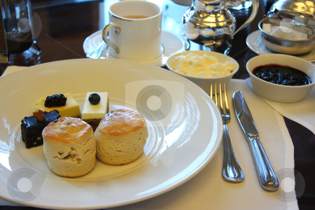 To use this stock image in your creative project, please select the size you need over to the right and click the "Add to Cart" button.
Your downloaded image will come with the Cutcaster watermark removed so don’t worry about the watermark you see on this page. Afternoon tea stock photo, Classic british afternoon tea with scones and cakes by Kheng Guan Toh