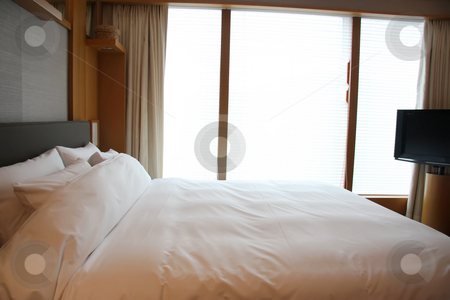 To use this stock image in your creative project, please select the size you need over to the right and click the "Add to Cart" button.
Your downloaded image will come with the Cutcaster watermark removed so don’t worry about the watermark you see on this page. Luxury bedroom stock photo, Elegant luxury bedroom in five star hotel by Kheng Guan Toh