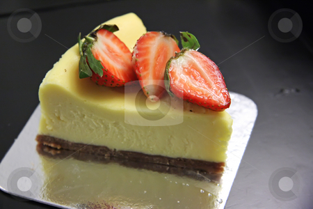 To use this stock image in your creative project, please select the size you need over to the right and click the "Add to Cart" button.
Your downloaded image will come with the Cutcaster watermark removed so don’t worry about the watermark you see on this page. Cheesecake stock photo, Slice of cheesecake with cut strawberries on top by Kheng Guan Toh