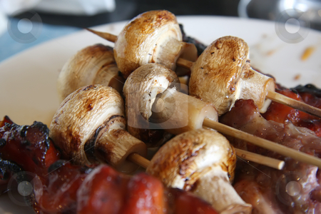 To use this stock image in your creative project, please select the size you need over to the right and click the "Add to Cart" button.
Your downloaded image will come with the Cutcaster watermark removed so don’t worry about the watermark you see on this page. Grilled meat and mushrooms stock photo, Grilled meat and mushrooms skewered on wooden sticks by Kheng Guan Toh